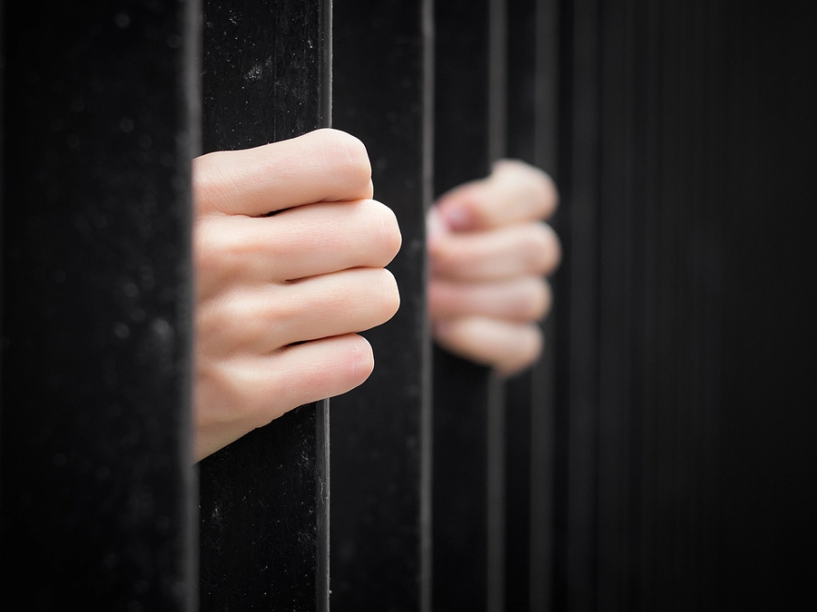 Imprisoned Hands behind bard